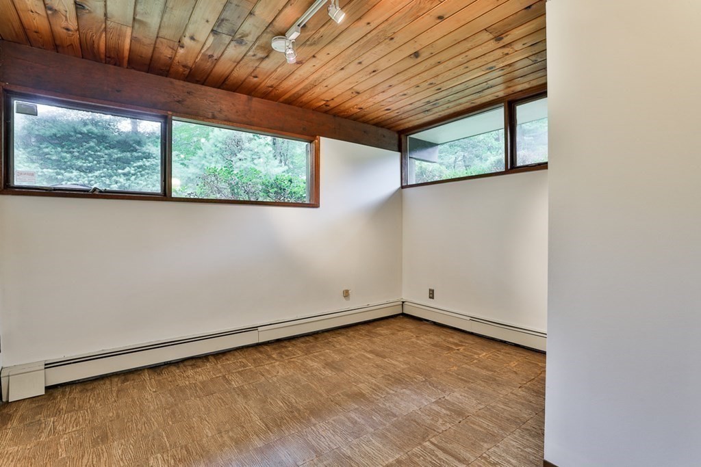62 Woodside Road Harvard, MA 01451 - Photo 30 of 36 an empty room with a window