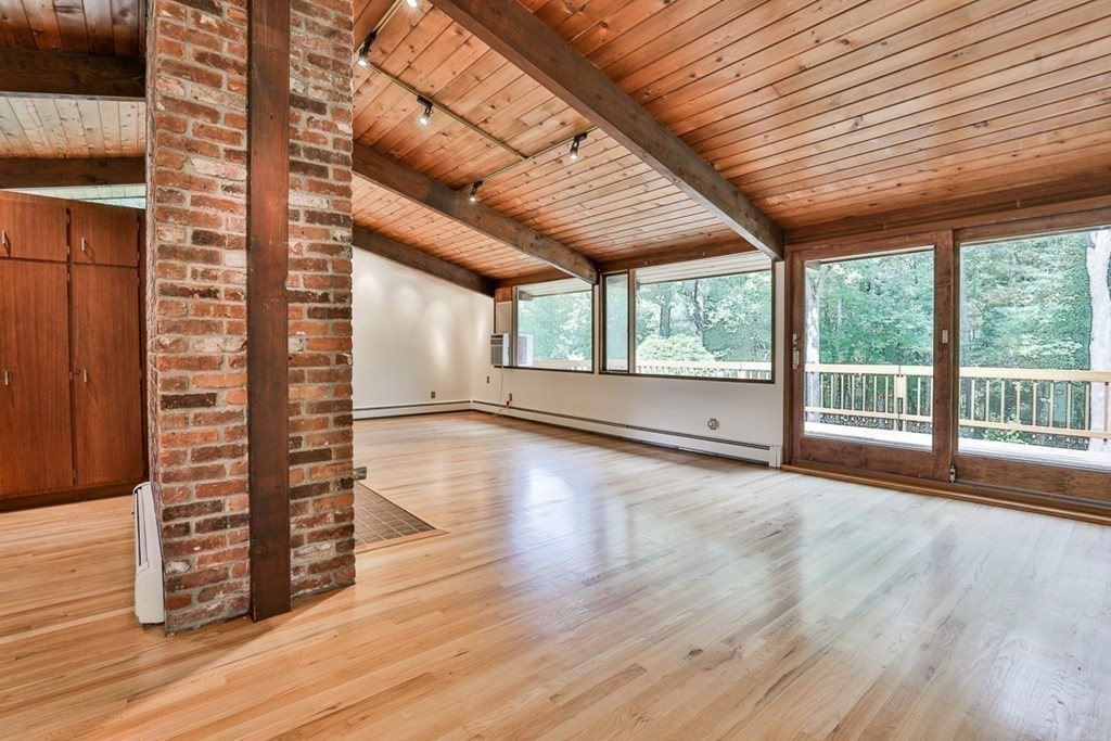 62 Woodside Road Harvard, MA 01451 - Photo 8 of 36 a view of empty room with wooden floor and fan
