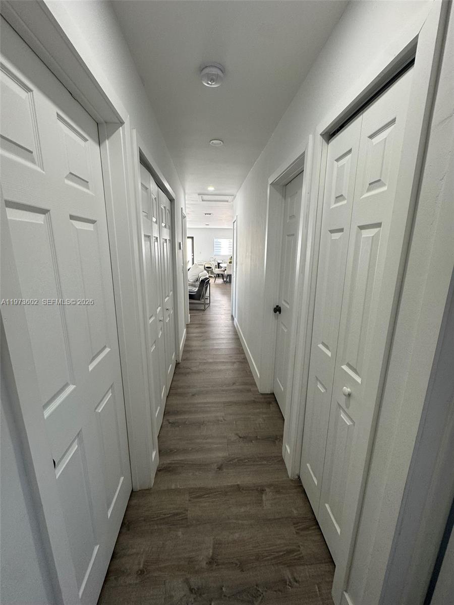 12534 Southwest 27th Street Miami, FL 33175 - Photo 21 of 49 a view of a hallway with wooden floor and stairs