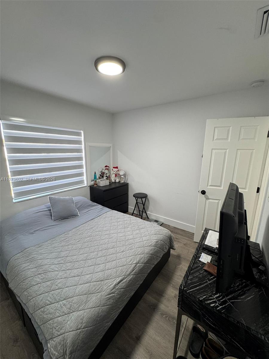 12534 Southwest 27th Street Miami, FL 33175 - Photo 26 of 49 a bedroom with a bed and a dresser