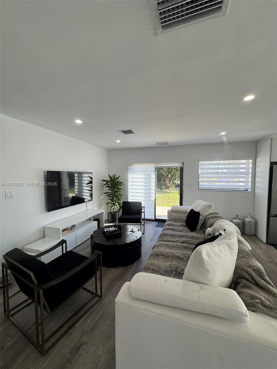 12534 Southwest 27th Street Miami, FL 33175 - Photo 4 of 49 a living room with furniture window and a flat screen tv