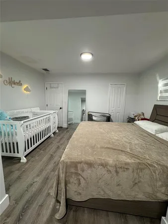 a bed room with a bed and a window