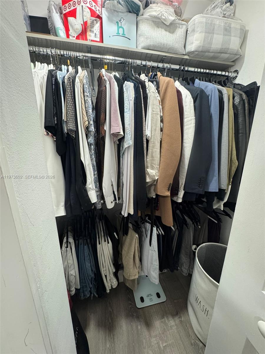 12534 Southwest 27th Street Miami, FL 33175 - Photo 49 of 49 a view of walk in closet with clothes and shoes