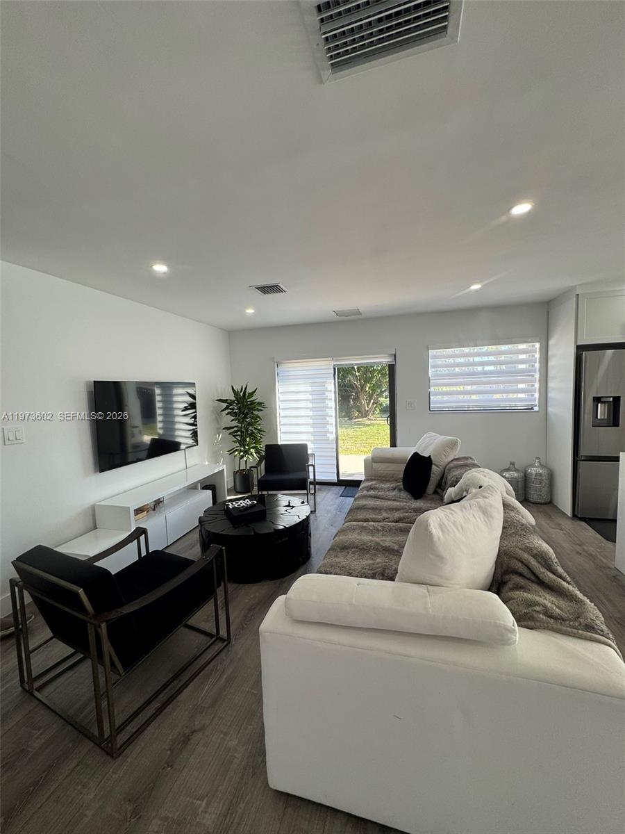 12534 Southwest 27th Street Miami, FL 33175 - Photo 5 of 49 a living room with furniture and a flat screen tv