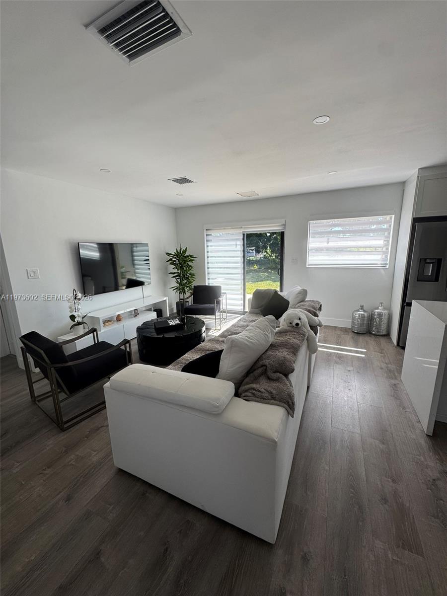 12534 Southwest 27th Street Miami, FL 33175 - Photo 7 of 49 a living room with furniture and a flat screen tv