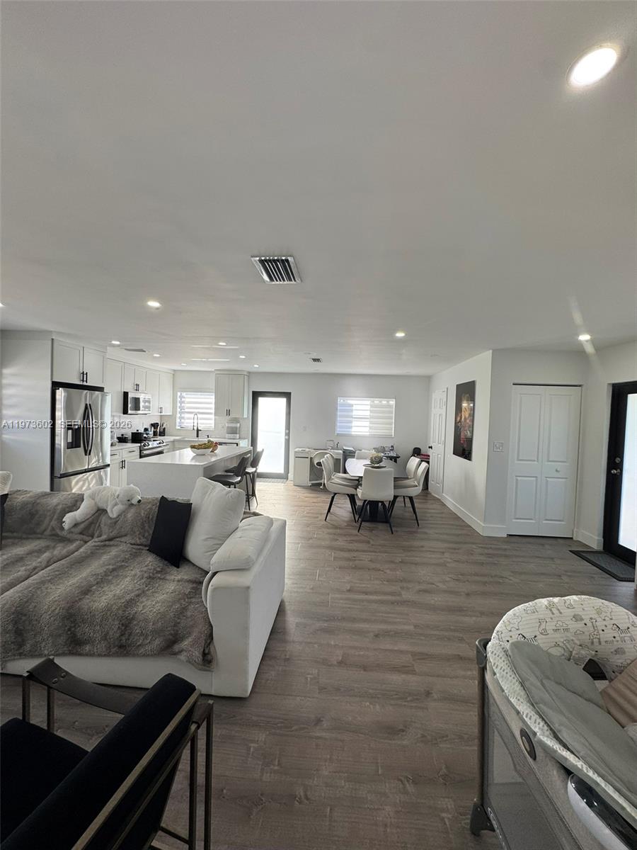 12534 Southwest 27th Street Miami, FL 33175 - Photo 10 of 49 a living room with furniture and a table