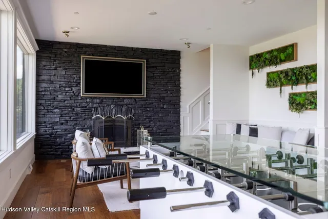 a dining room with furniture and wooden floor