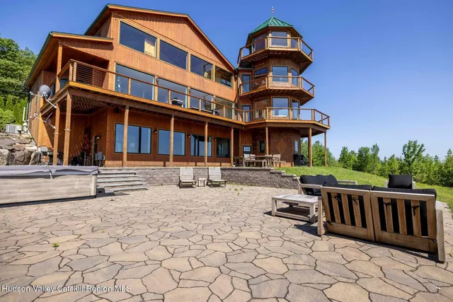 a kitchen with stainless steel appliances granite countertop a sink and cabinets with wooden floor