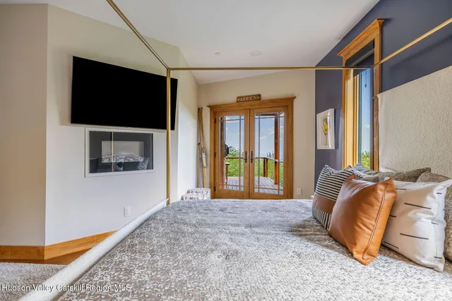 a view of a balcony with furniture and wooden floor