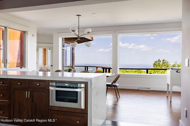 a open kitchen with granite countertop a sink and refrigerator
