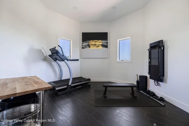 a view of a chairs and table in the patio