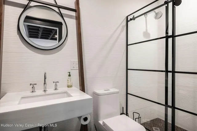 a view of a lush green outdoor space with a lake view