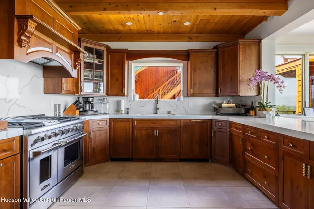 a kitchen with a sink and a stove