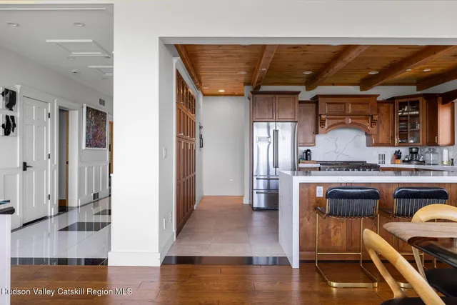 a living room with fireplace furniture and a flat screen tv