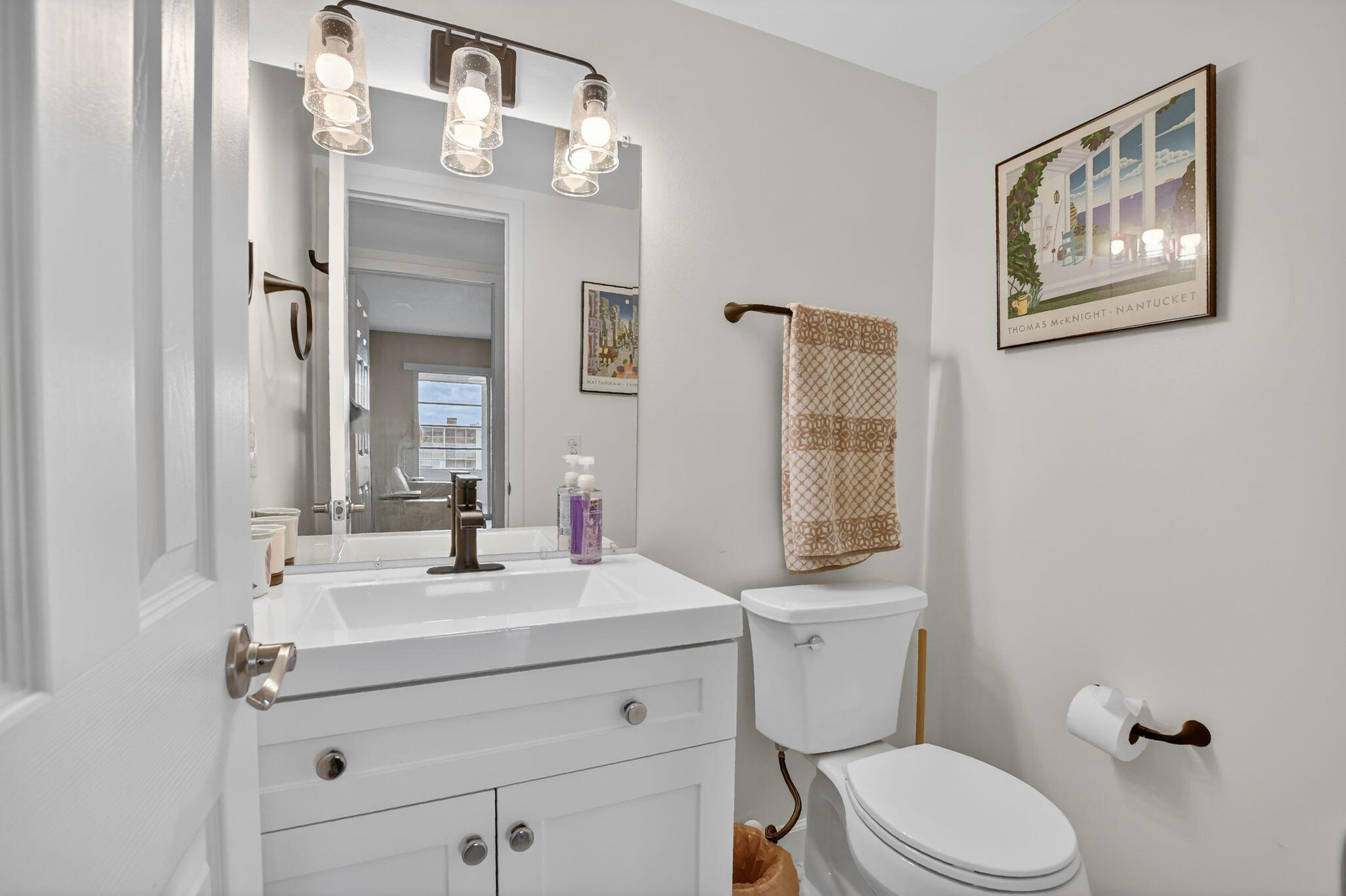 4051 Guilford C Boca Raton, FL 33434 - Photo 21 of 44 a bathroom with a sink vanity mirror and toilet