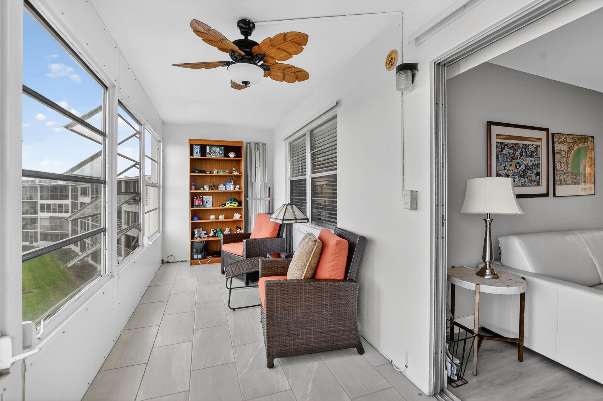 4051 Guilford C Boca Raton, FL 33434 - Photo 22 of 44 a living room with furniture and a book shelf