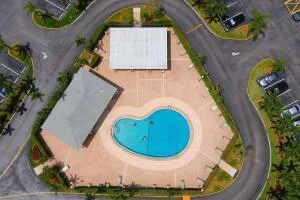 an aerial view of a house with garden space sitting space and swimming pool