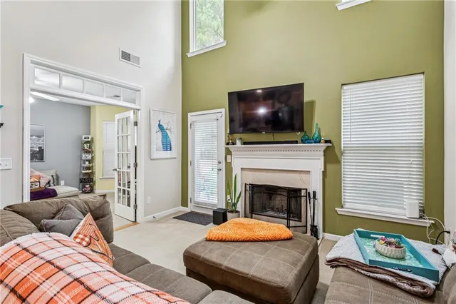 a bedroom with a bed and a fireplace