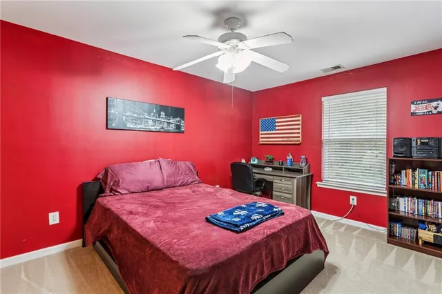 a bedroom with a bed and dresser