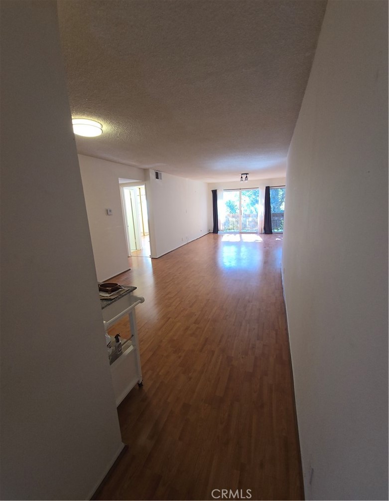 12157 Moorpark Street, Unit 206 Studio City, CA 91604 - Photo 15 of 17 wooden floor in a hall with an entryway