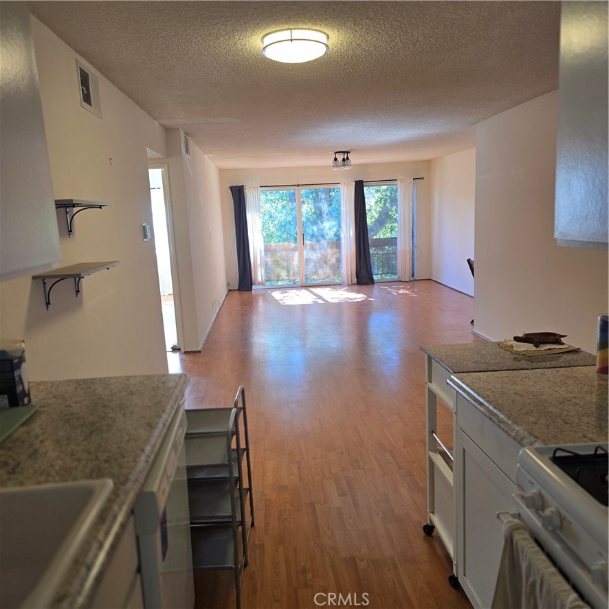 12157 Moorpark Street, Unit 206 Studio City, CA 91604 - Photo 6 of 17 a kitchen with a stove and a sink