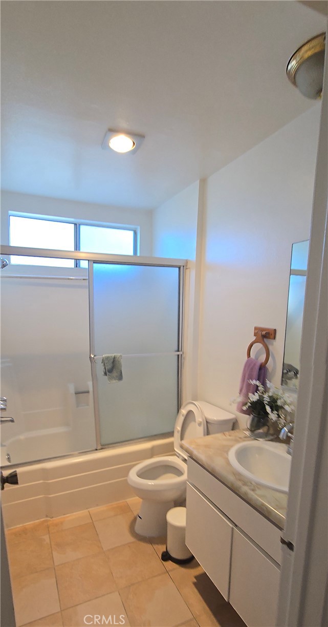 12157 Moorpark Street, Unit 206 Studio City, CA 91604 - Photo 9 of 17 a bathroom with a sink a toilet and shower