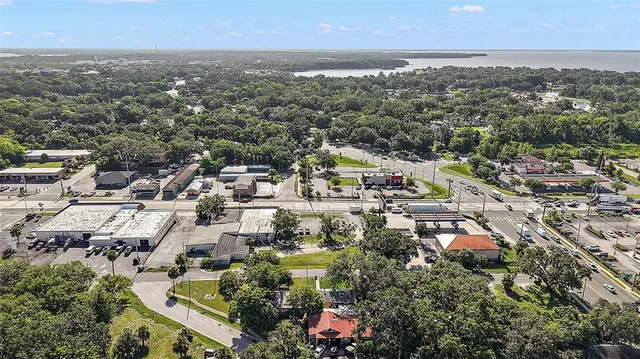 an aerial view of residential houses with city view