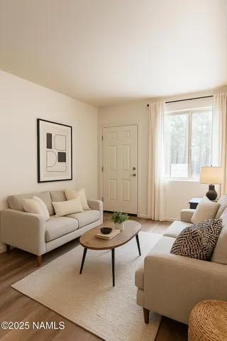 a living room with furniture and a window