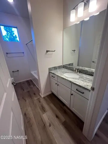a bathroom with a sink a vanity and a mirror
