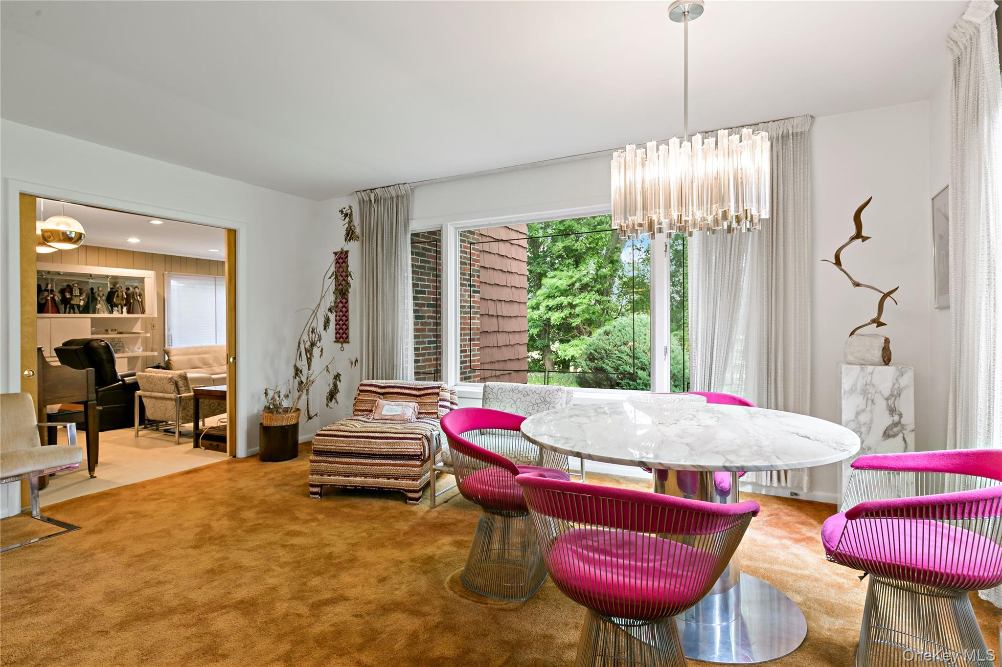16 Meadow Road Scarsdale, NY 10583 - Photo 6 of 47 a living room with furniture and a chandelier