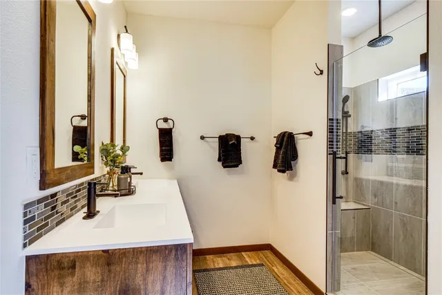 a bathroom with a sink and a mirror