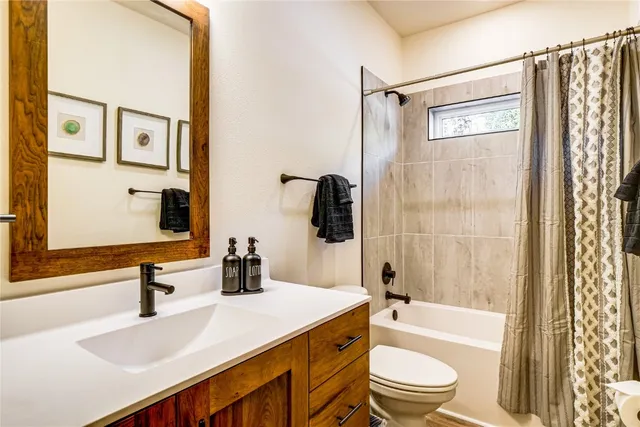 a room with furniture pool table and windows