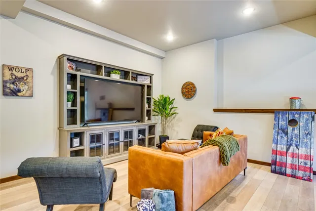 a kitchen with stainless steel appliances kitchen island granite countertop a sink and cabinets