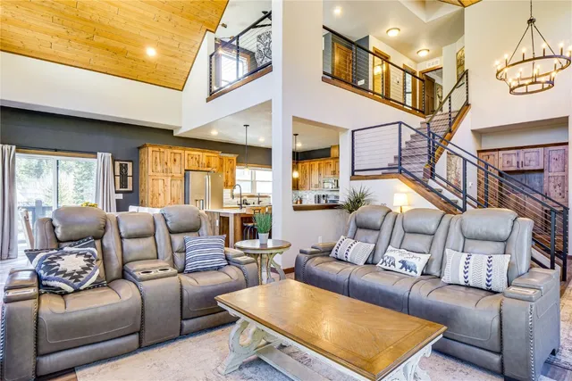 a living room with furniture dining table and a large window