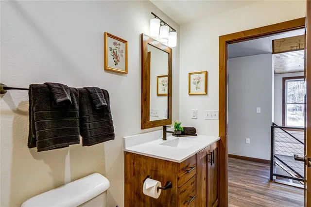 a view of a balcony with chair and wooden fence