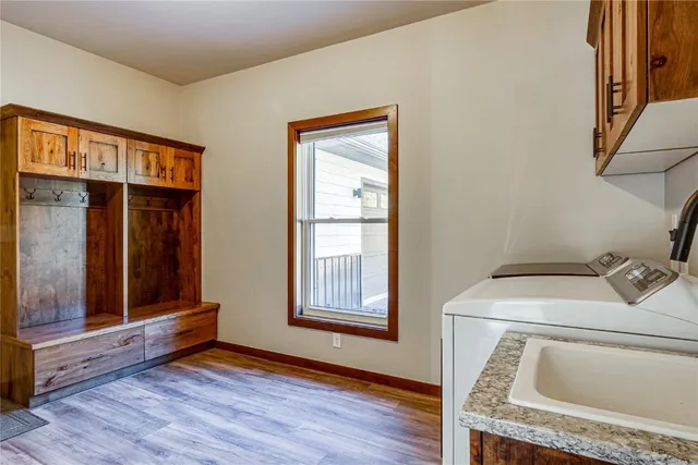 a view of balcony with wooden floor and fence