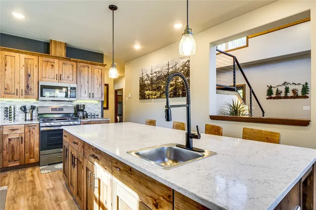 a kitchen with a stove and a microwave