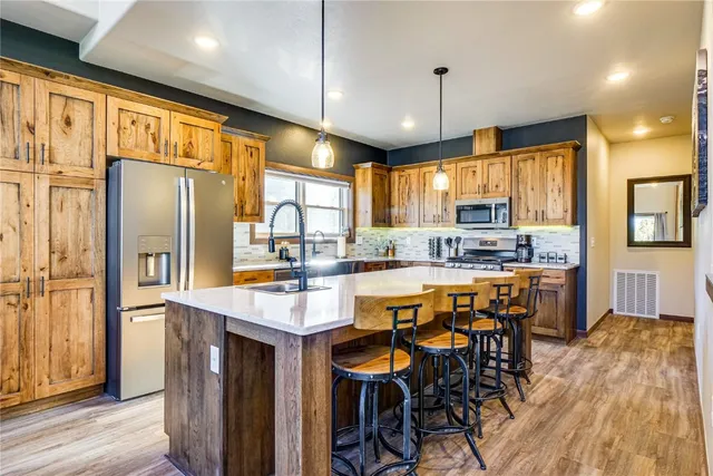 a bedroom with a large bed and a large window