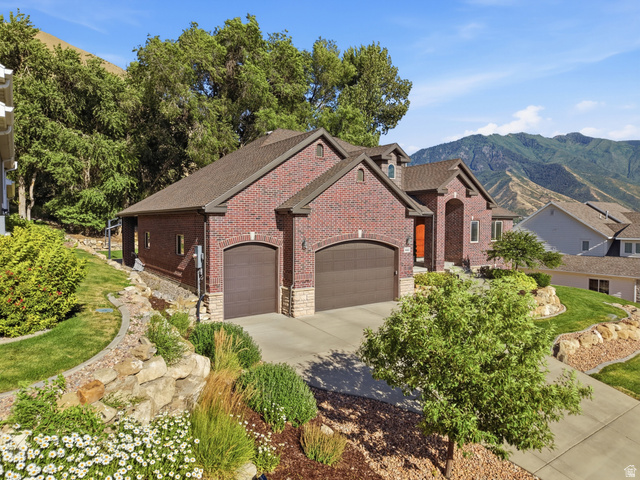 441 South 2080th Street East Springville, UT 84663 - Photo 3 of 64 Brick exterior featuring two integrated garages and stone accents