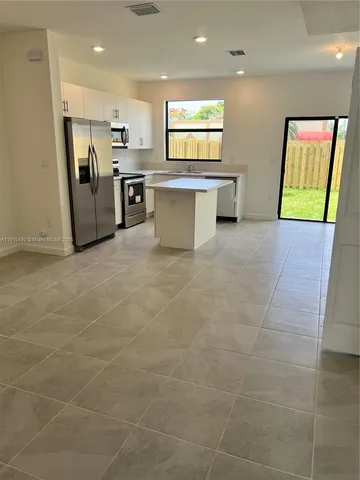a view of an empty room with a sink