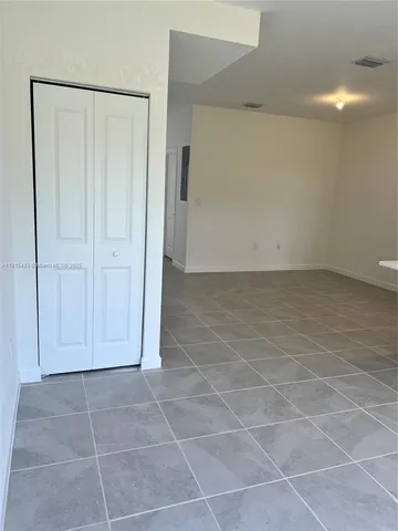 a kitchen with stainless steel appliances a sink and a refrigerator