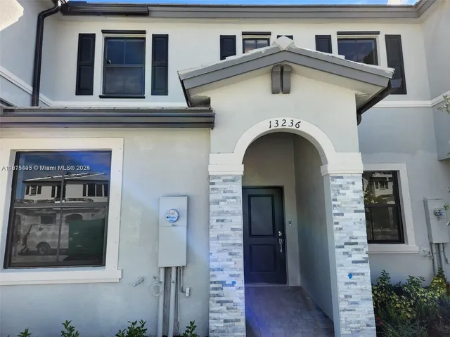 a view of a house with entryway and windows