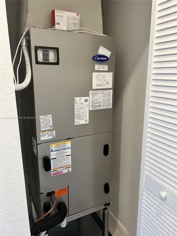 a white bath tub sitting next to a toilet