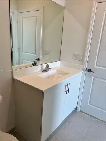 a bathroom with a toilet and a bath tub