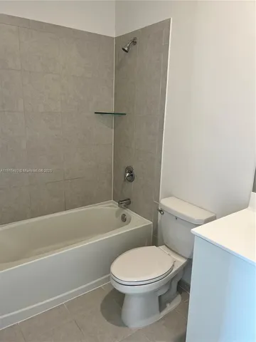 a view of a kitchen from the hallway