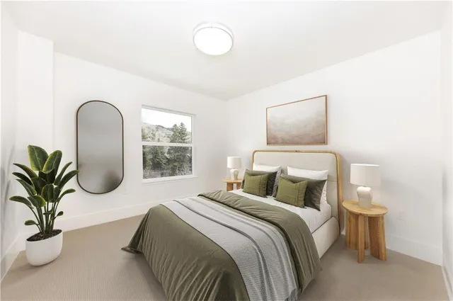 a bedroom with bed and a window