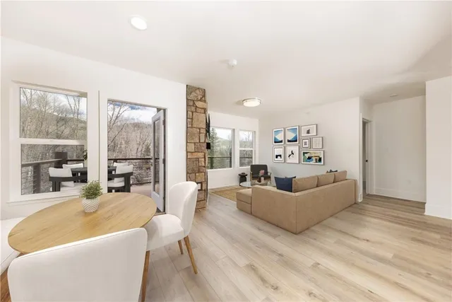 a living room with furniture and a large window