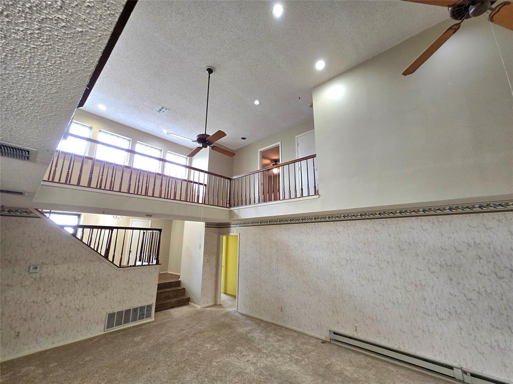 a view of staircase with large window