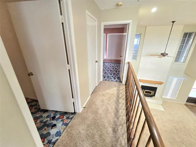 a view of a kitchen from the hallway
