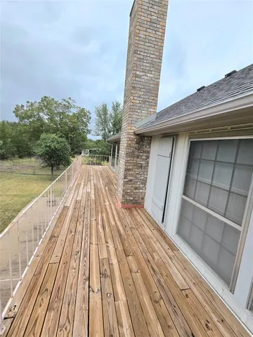 a view of wooden balcony with ocean view